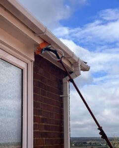 soffit cleaning house using extended hose